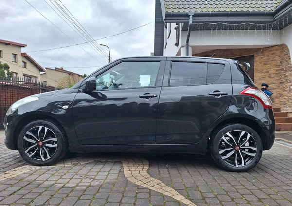 Suzuki Swift cena 34700 przebieg: 100200, rok produkcji 2015 z Żychlin małe 326